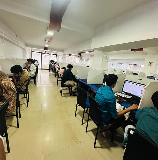 Students taking the XIQ examination at a designated centre